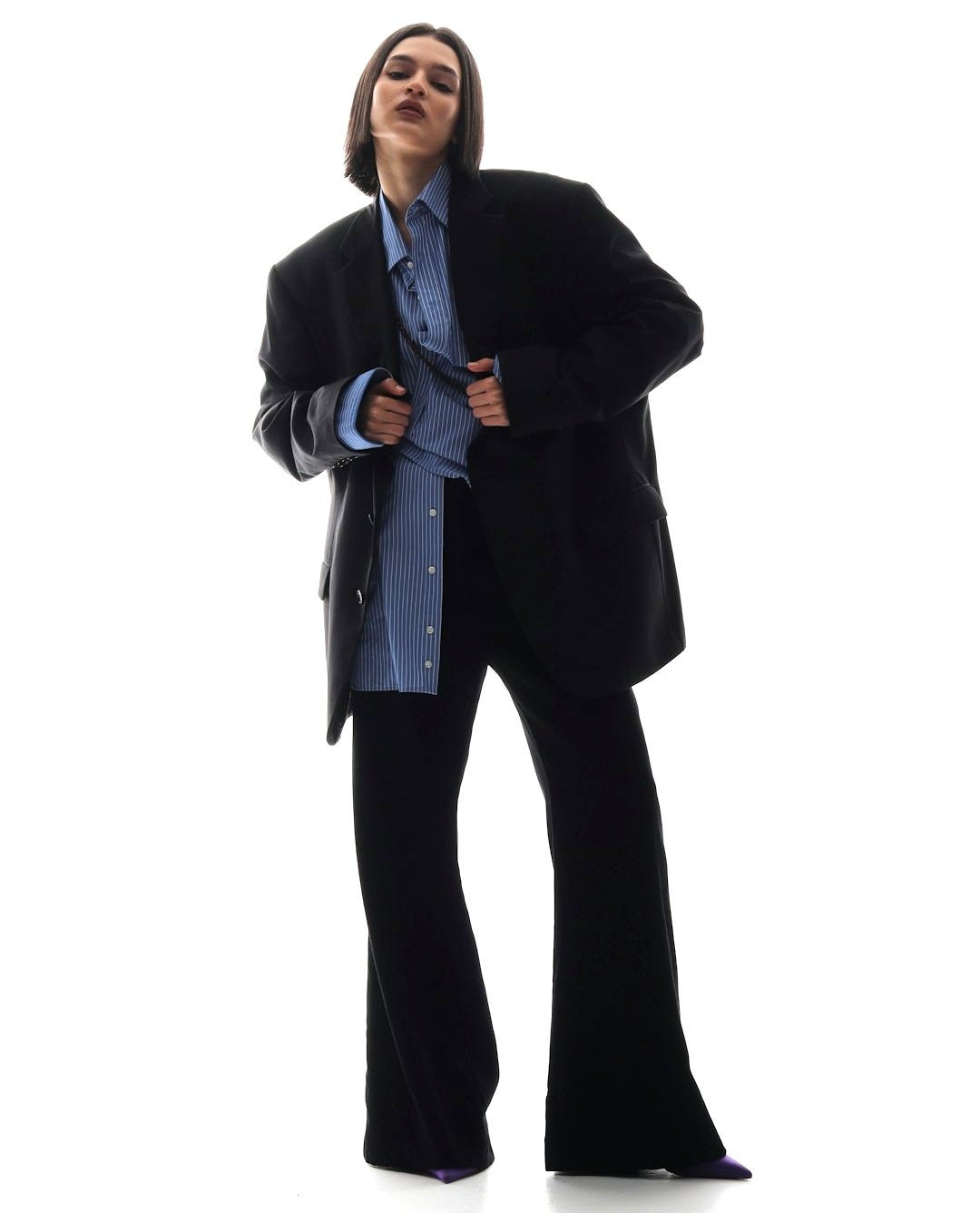 a man in a suit is posing for a picture a man in a suit is posing for a picture