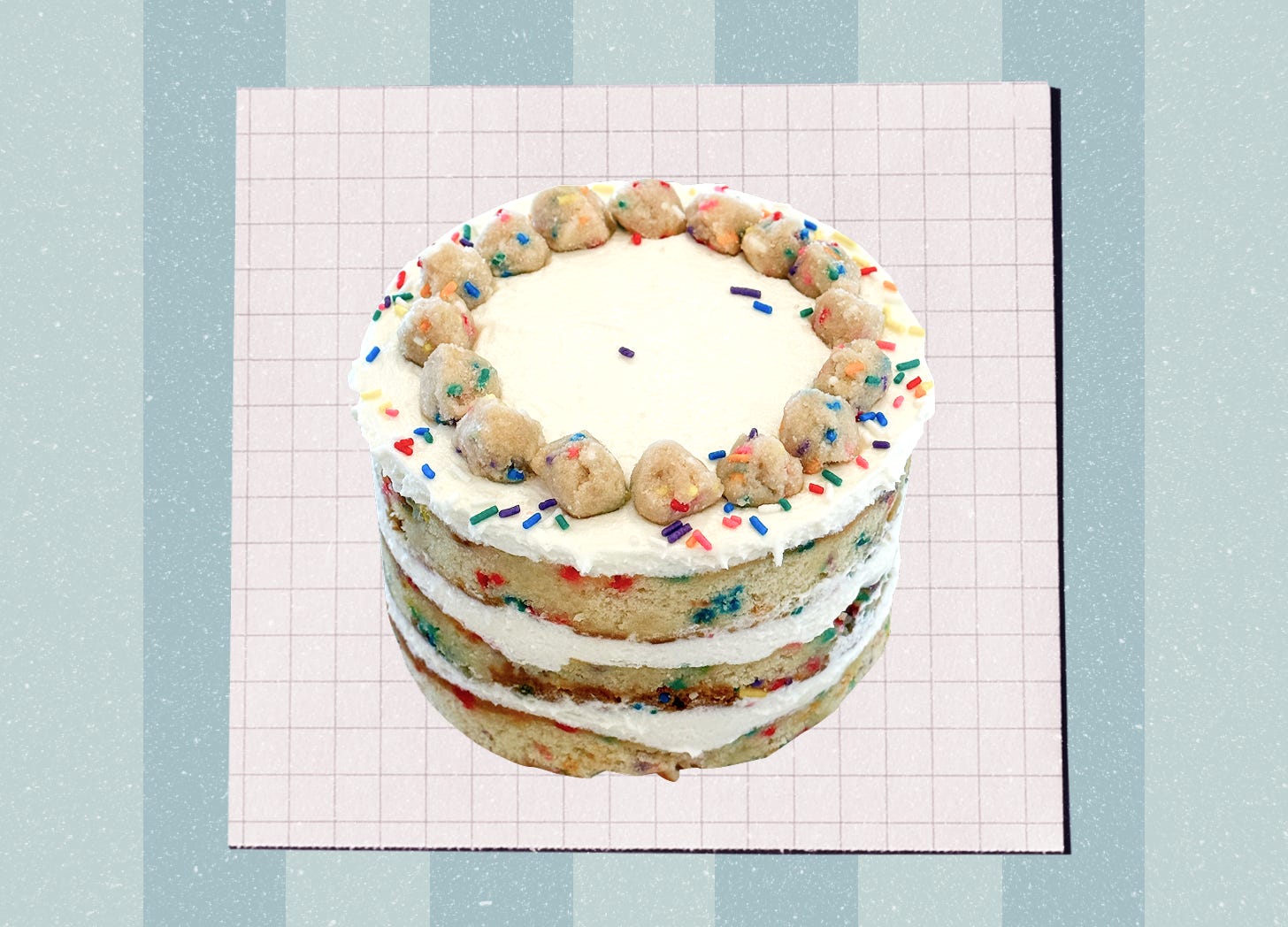A birthday cake that is frosted only on the top, revealing its layers of frosting and funfetti cake along the sides