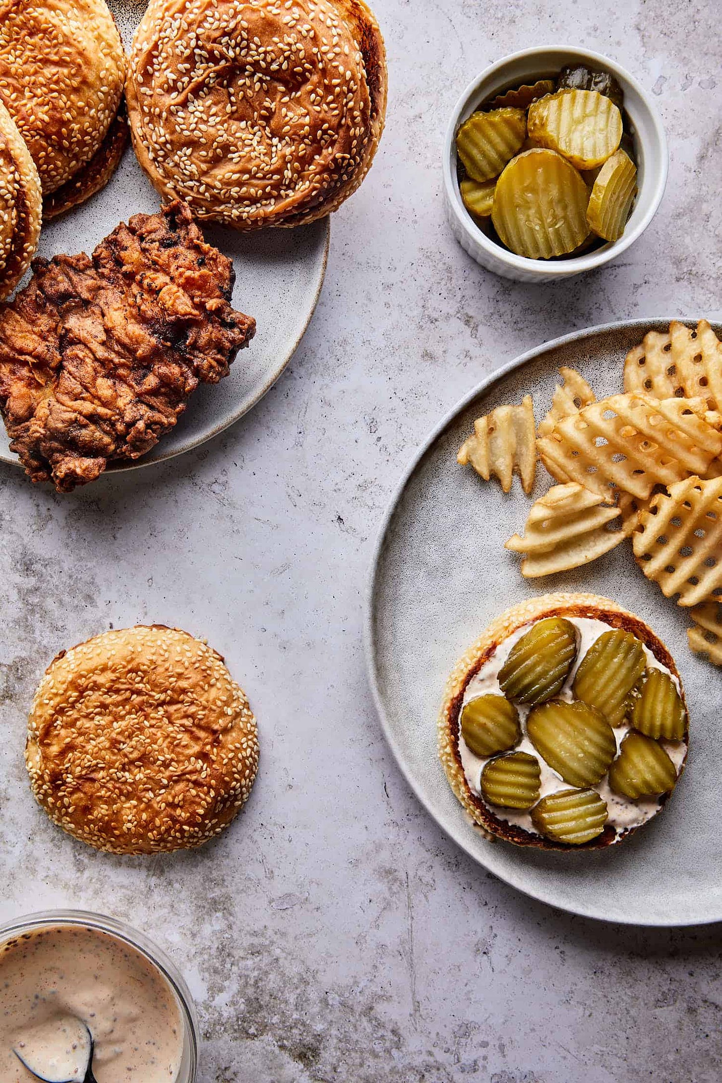 Toasted brioche buns with shredded lettuce and pickles, ready to serve created from the best fried chicken sandwich recipe on the internet.,
Toasted brioche buns with shredded lettuce and pickles, ready to serve created from the best fried chicken sandwich recipe on the internet.,