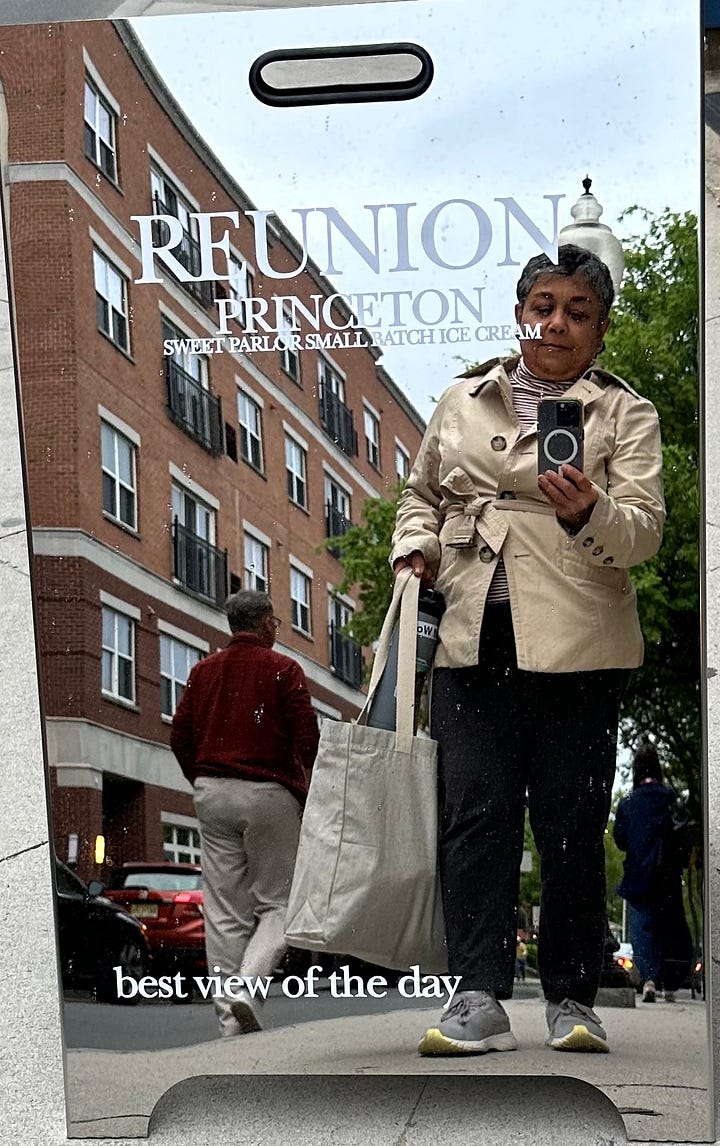 reflected selfie and a portion of a mural