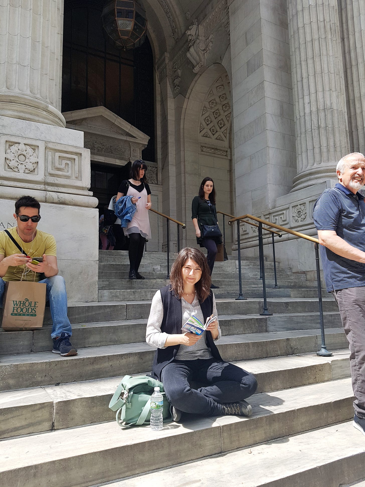 A younger dreamer version of me, sitting on the steps of the National Library.