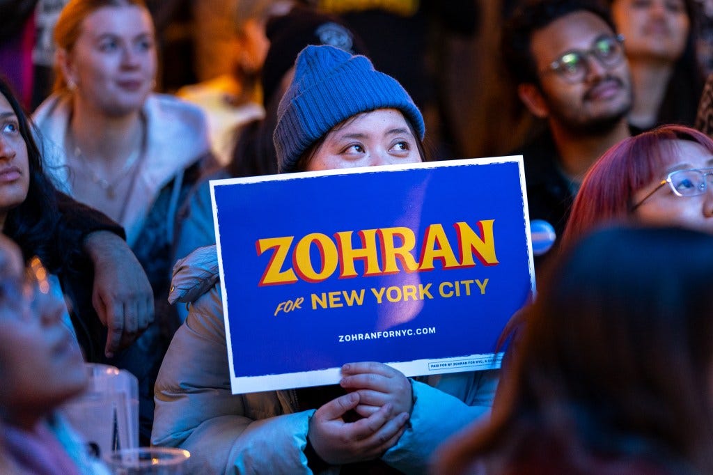 Supporters watch as Zohran Mamdani delivers a speech following his mayoral victory at an election-night watch party at the Bohemian Hall & Beer Garden on Nov. 4, 2025 in the Queens borough of New York City.