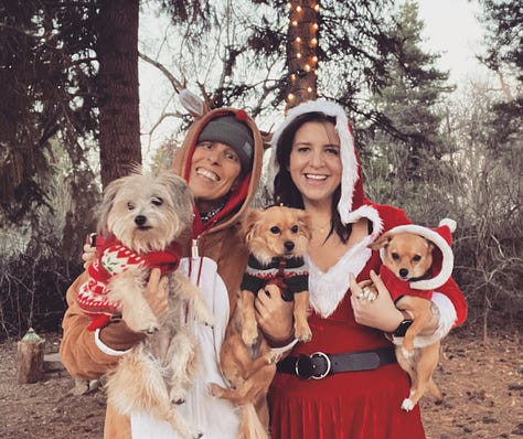 A series of photos of Andrea and Meg on Christmases throughout the years, usually featuring trees, lights, Santa outfits, and dogs in festive sweaters. There are also two red holiday mugs, one that says "Hers", and its pair, that says, "Theirs"