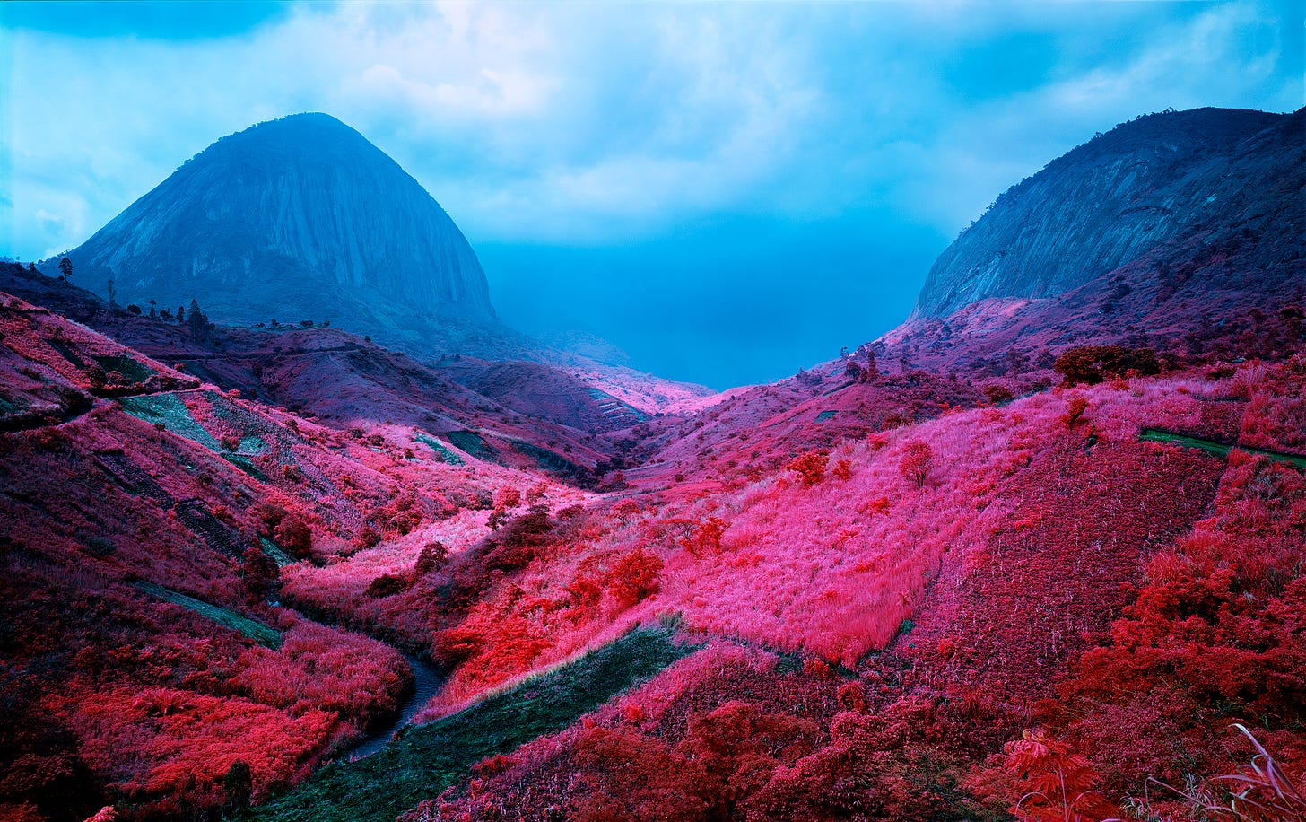 A valley with red and blue colors

Description automatically generated with medium confidence
