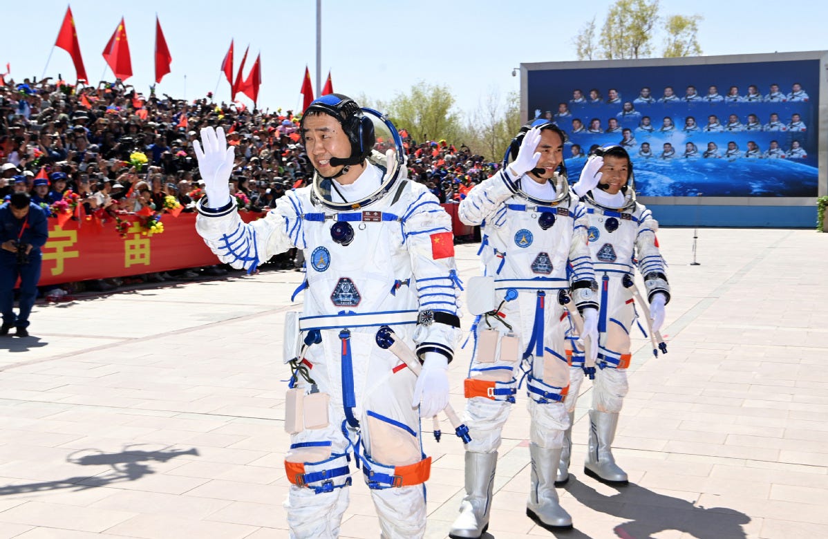 Chen Dong (left), Chen Zhongrui (center), and Wang Jie (right) ahead of the launch of Shenzhou-20 in April 2025.