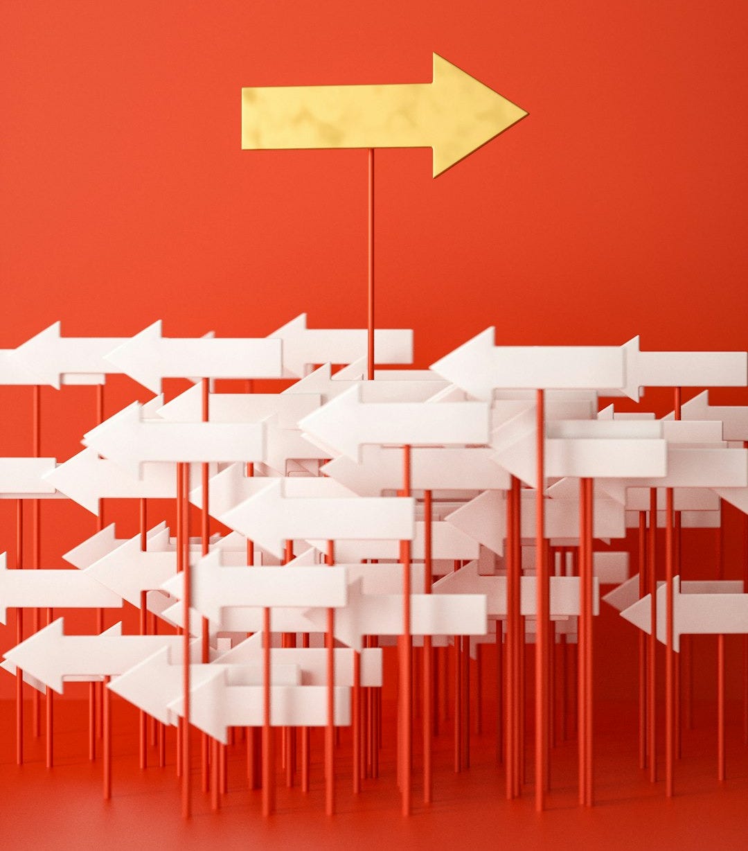 a red wall with a yellow arrow pointing in opposite directions