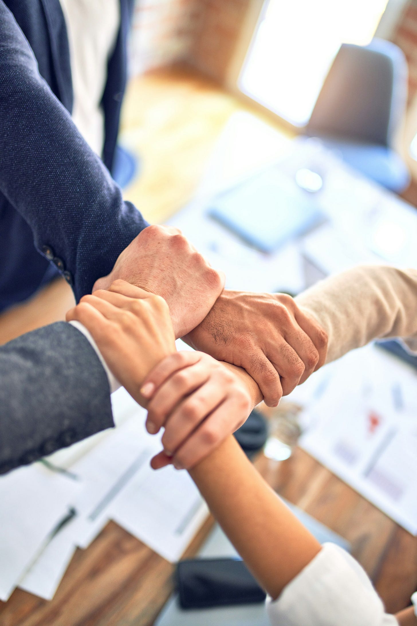 person in black long sleeve shirt holding persons hand person in black long sleeve shirt holding persons hand