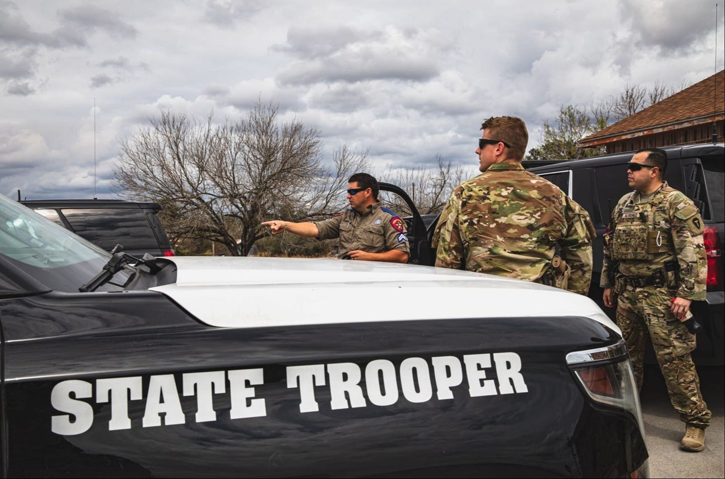 Texas National Guardsmen and a Texas State Trooper conduct a joint enforcement action in South Texas along the border with Mexico.