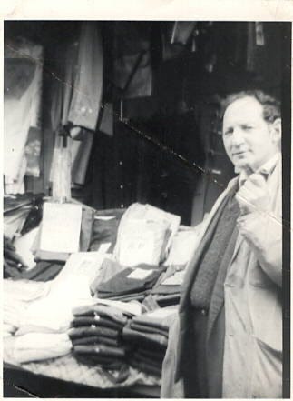 photo of my father outside his shop and stall