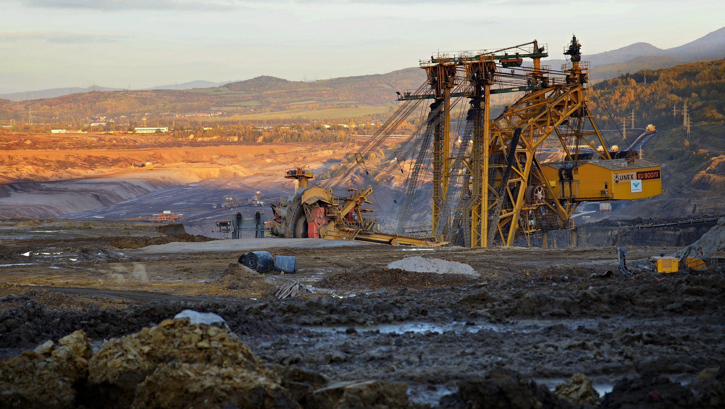 A diesel burning bucket-wheel excavator tears up the Earth. A diesel burning bucket-wheel excavator tears up the Earth.