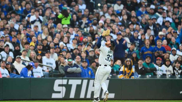 Mar 26, 2026; Seattle, Washington, USA; Seattle Mariners third baseman Brendan Donovan (33) catches a fly ball hit by Cleveland Guardians left fielder Steven Kwan (38) (not pictured) during the first inning at T-Mobile Park. Mandatory Credit: Steven Bisig-Imagn Images | Steven Bisig-Imagn Images