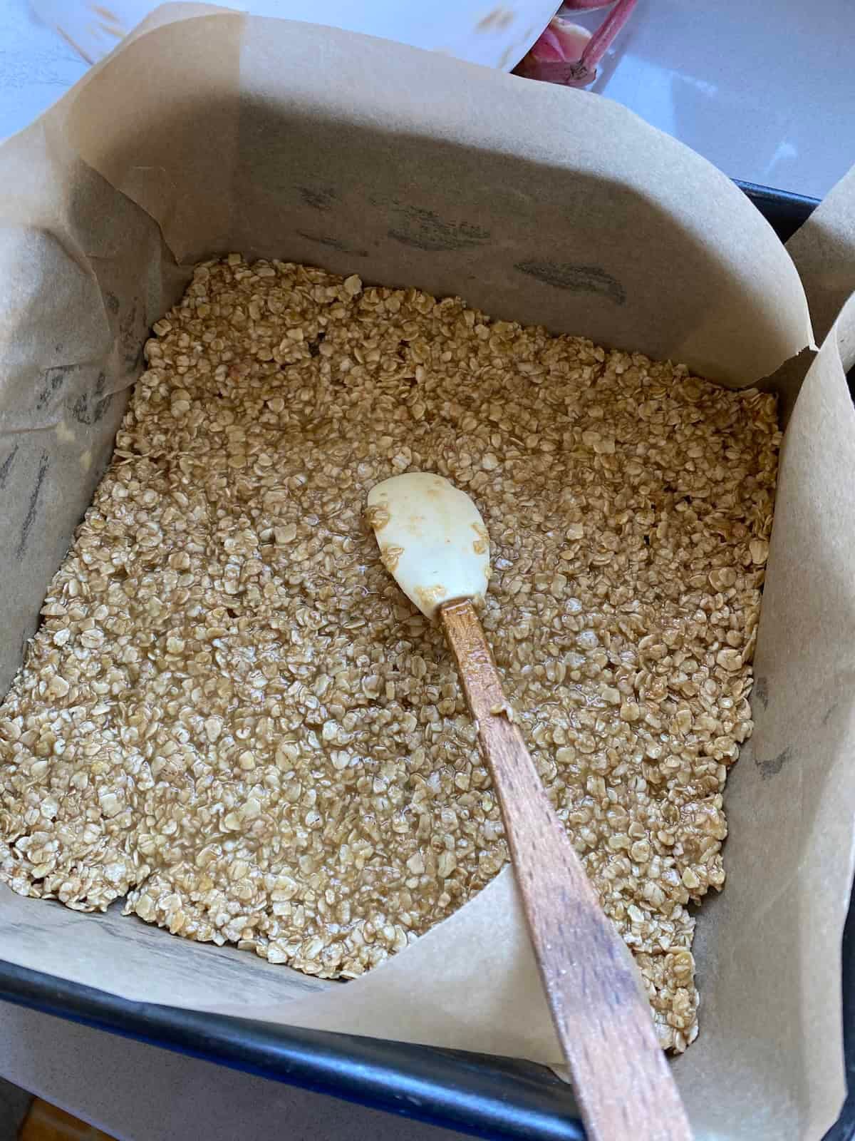 Flapjack mixture in a square tin. Flapjack mixture in a square tin.