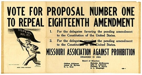 A black-and-white photograph of a printed sign titled “Proposal for Repeal of the 18th Amendment” by the Missouri Association Against Repeal, likely from the early 1920s. The sign lists points opposing the repeal of Prohibition, framed in formal, persuasive language. It reflects organized pro-prohibition sentiment and offers a glimpse into the political rhetoric used by those hoping to maintain the national alcohol ban.