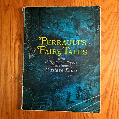six childhood books set against wood or dark cloth