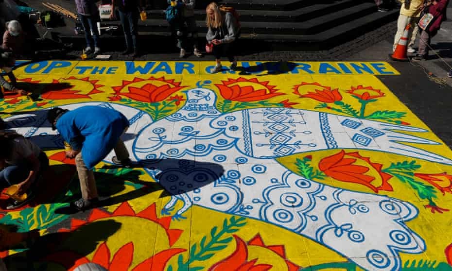 Peace protesters in San Francisco recreate A Dove Has Spread Her Wings and Asks for Peace by the Ukrainian artist Maria Prymachenko.