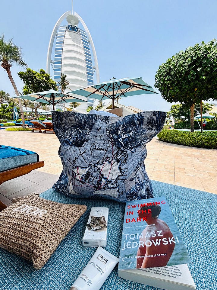 A gallery of pictures showing Dior beauty and accessories on holiday and on a bathroom shelf