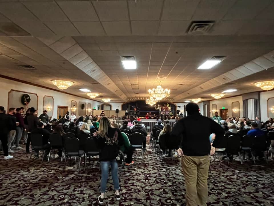 May be an image of 6 people, lighting, table and crowd
