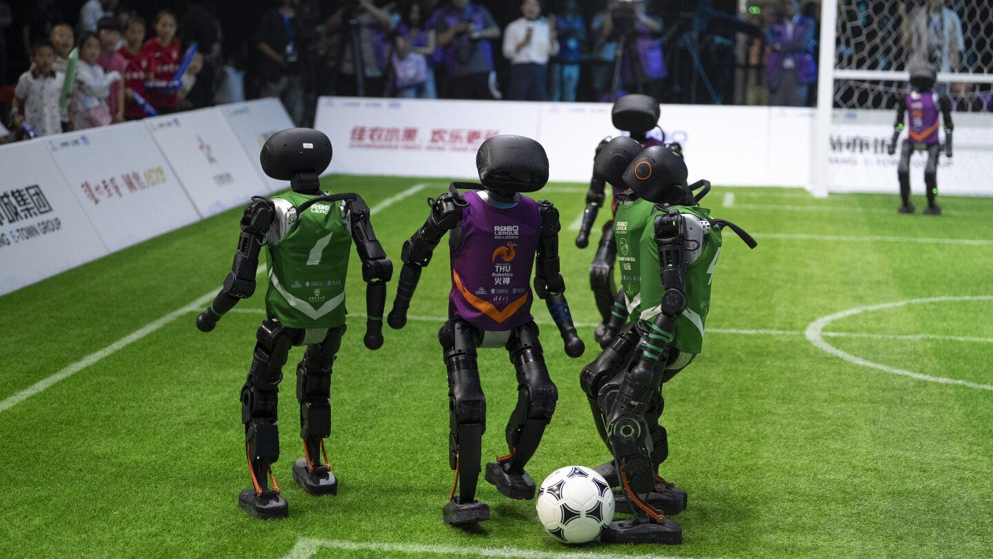 Beijing hosts China's first fully autonomous 3-on-3 AI robot soccer match |  AP News