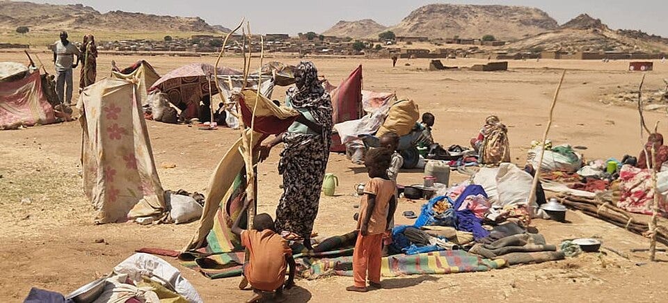 File:Tawila refugees setting up shelter.jpg File:Tawila refugees setting up shelter.jpg