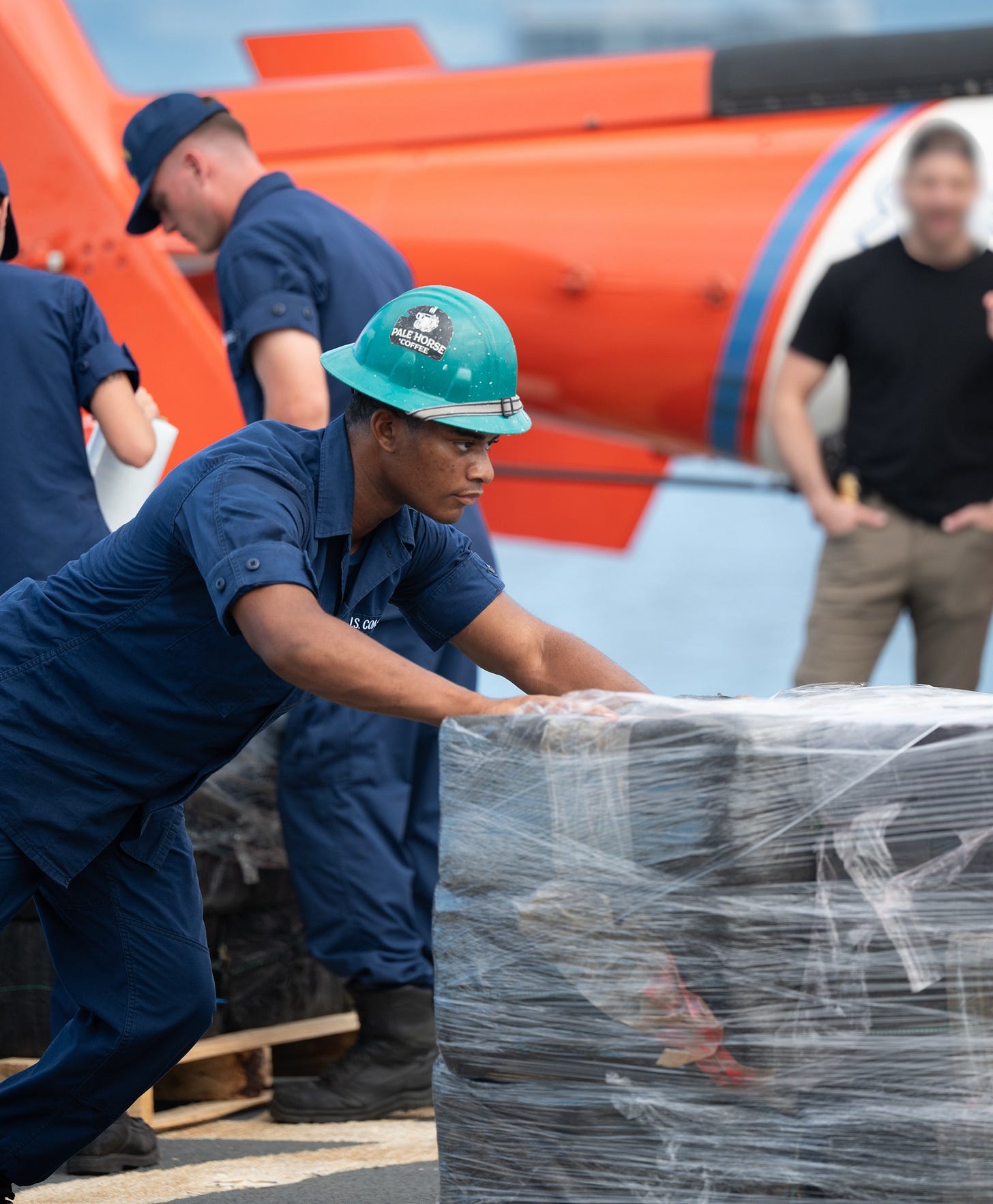 US. Coast Guard Seaman Roberts, assigned to Coast Guard Cutter Tampa, assists with a drug offload at Port Everglades, Florida, Oct. 14, 2026. (US Coast Guard photo)