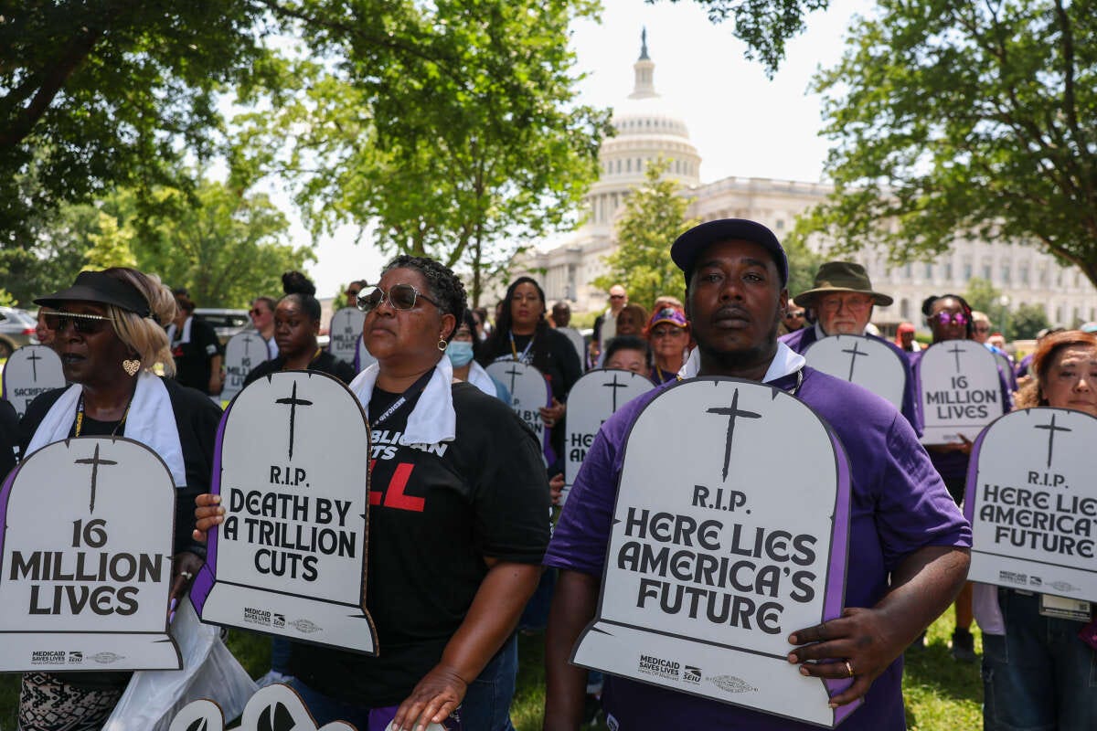 Care workers with the Service Employees International Union (SEIU) participate in a living cemetery protest to denounce the impact to patients, families, and workers if Republicans cut Medicaid, health care, and SNAP to pay for tax cuts for the wealthy, at the U.S. Capitol on June 23, 2025, in Washington, D.C.