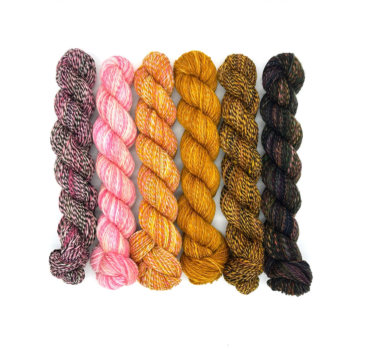 photo of skeins of hand spun yarns made from WoolTribe hand dyed fiber. The skeins in the image are in the Summer 2025 issue of Spin Off Magazine. photo of skeins of hand spun yarns made from WoolTribe hand dyed fiber. The skeins in the image are in the Summer 2025 issue of Spin Off Magazine.