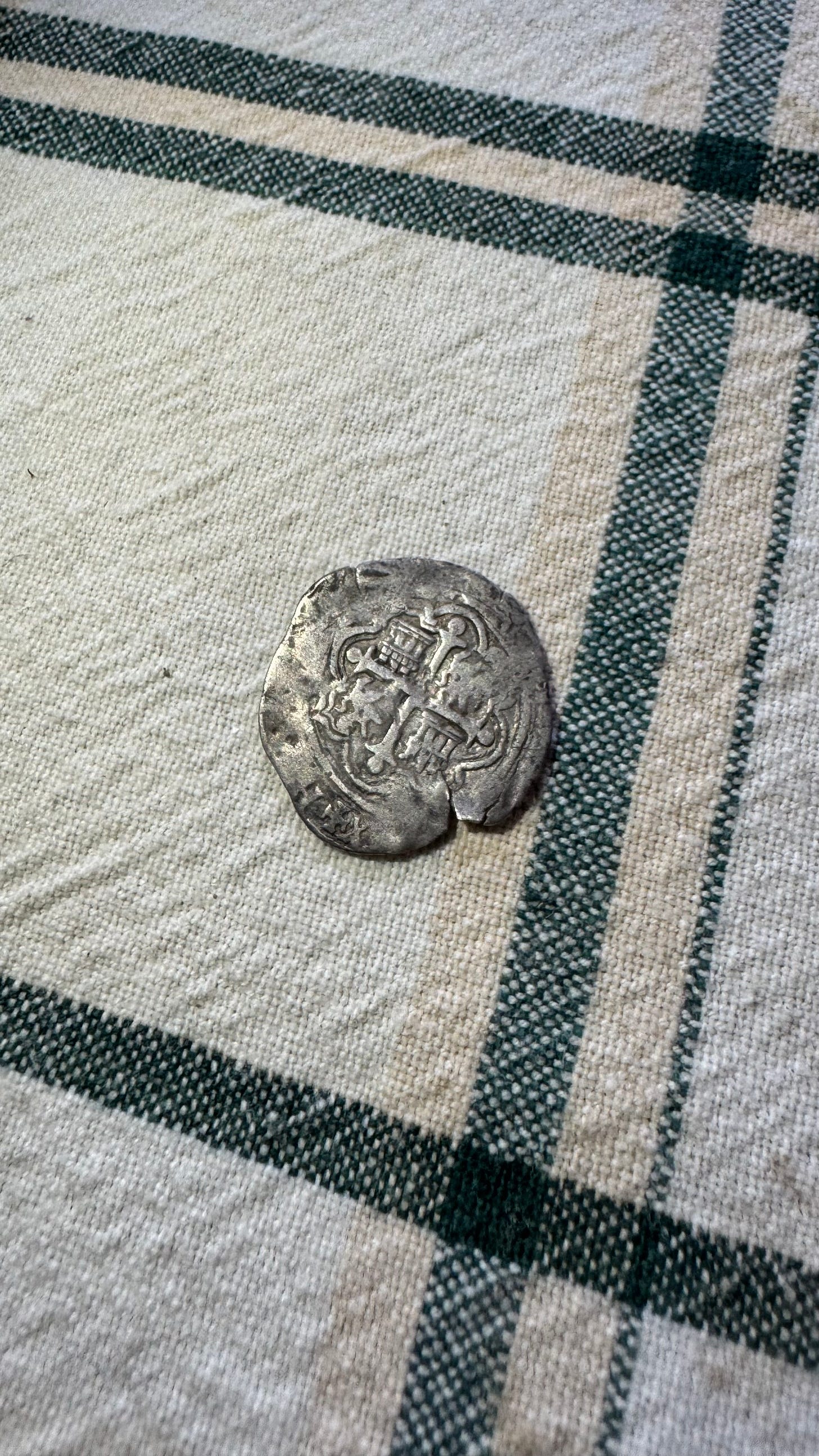 A silver Spanish colonial coin found in Oaxaca, Mexico.