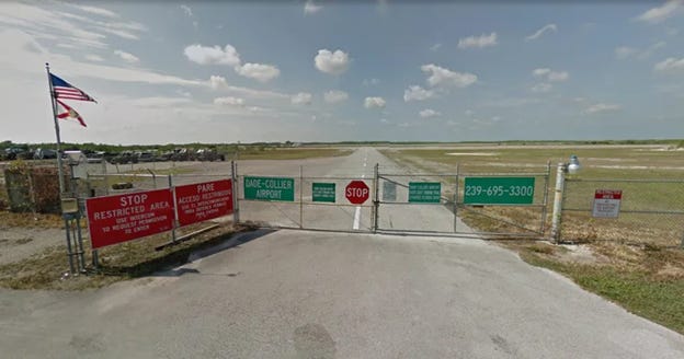 A gated area with signs on it

AI-generated content may be incorrect.