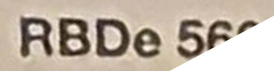 A zoom of the text visible in the original train photo. It says "RBDe 560".