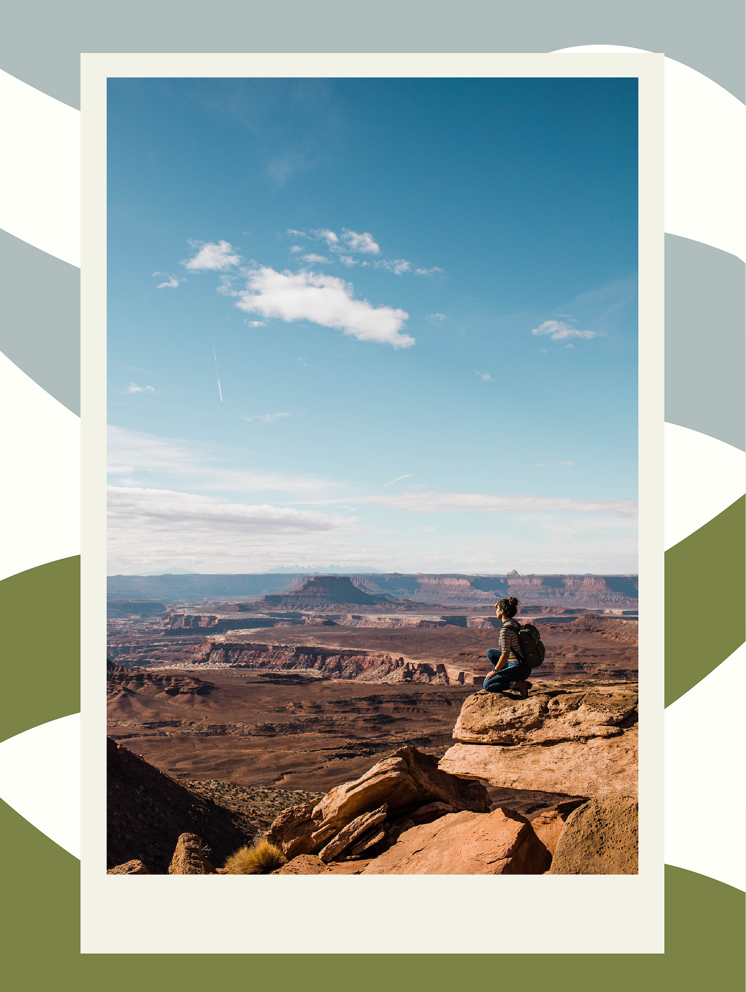hiker sitting on the edge of a canyon in the Utah desert