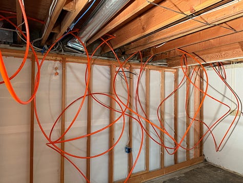 Mosaic of images showing hydronic radiant floor heating being installed.