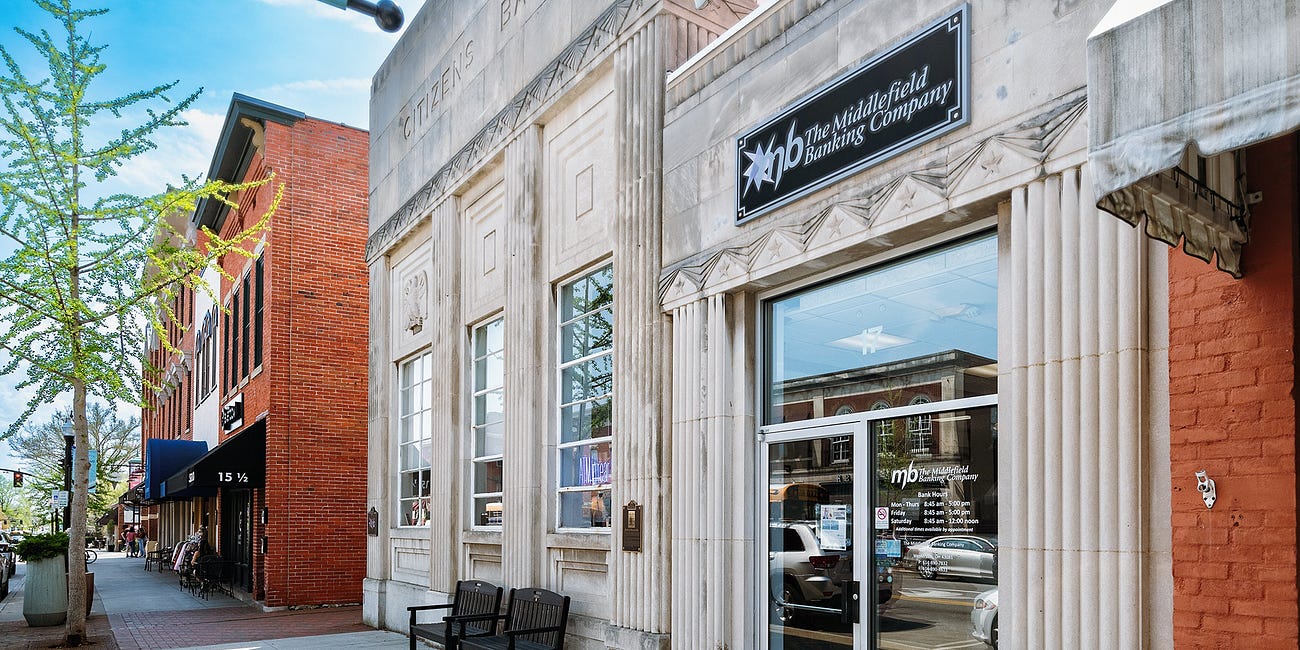 Land Trade Moves Bank From Uptown
