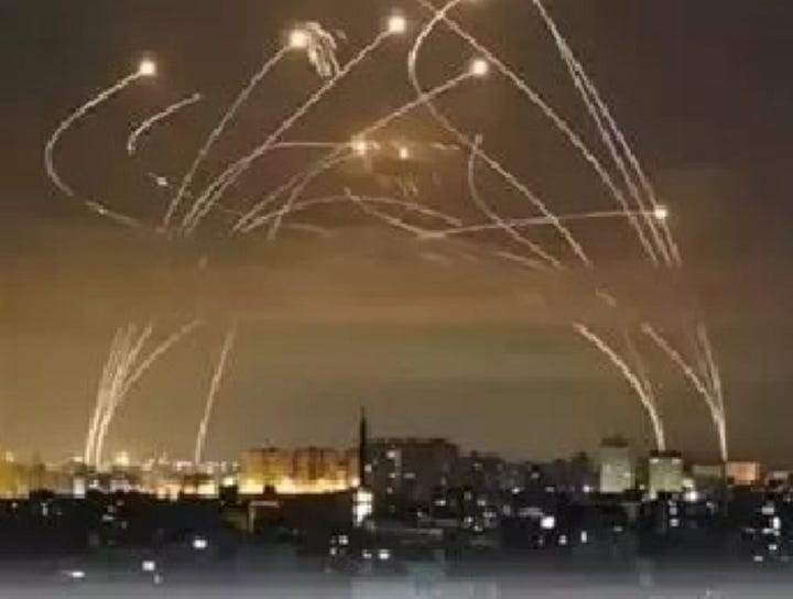 Left photo of iron dome in action; right celebratory fire works