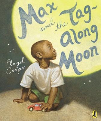Cover art for "Max and the Tag-Along Moon" by Floyd Cooper. A young, Black boy kneels on the ground, plating with a toy car. His face is turned upward, toward a fantastically full, bright moon.