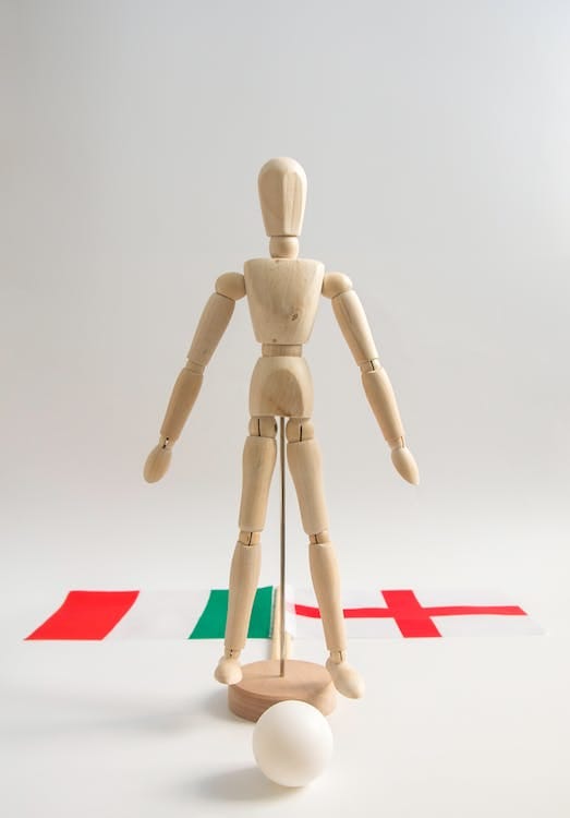 Free Close-Up Shot of a Wooden Human Figurine Stock Photo