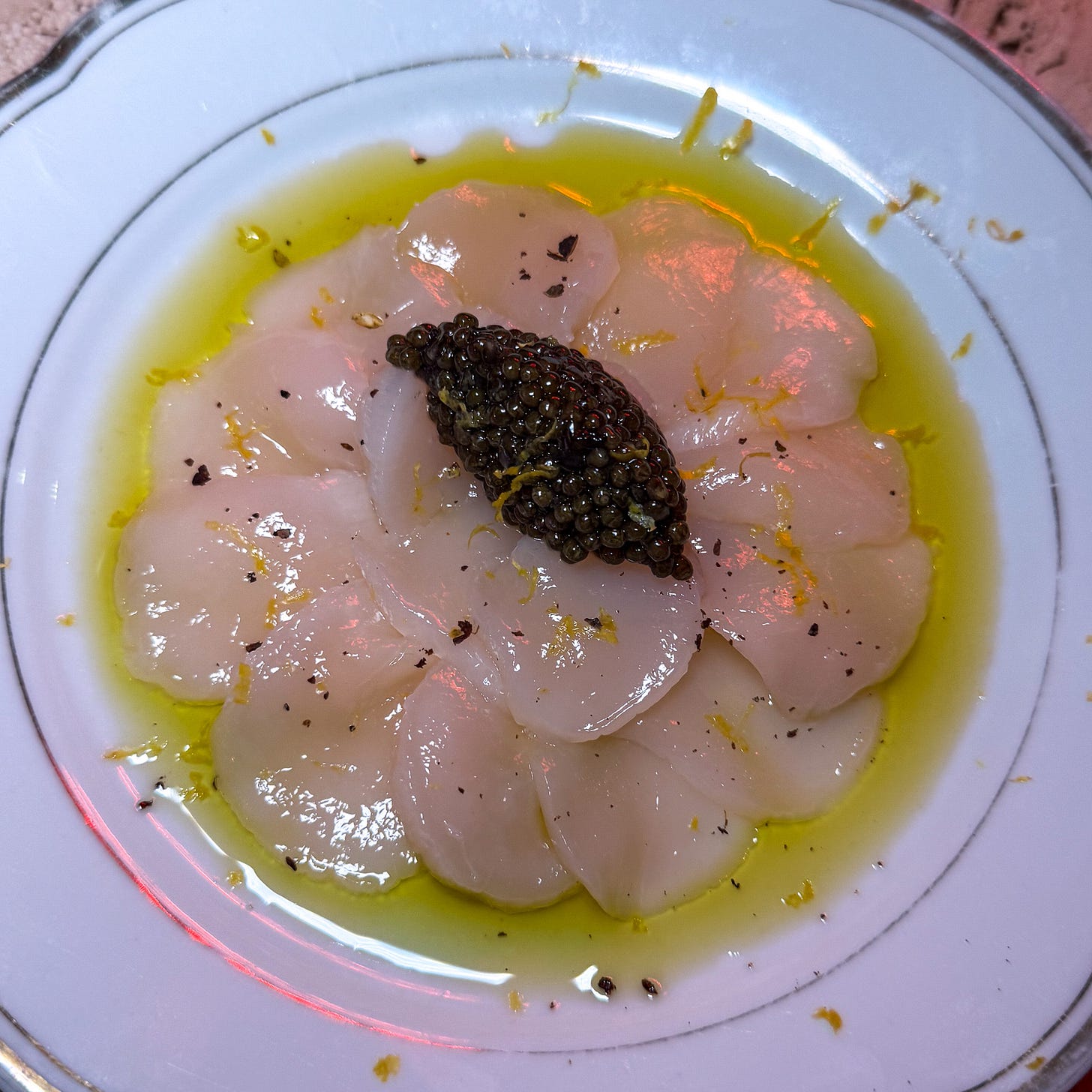 Sea scallop carpaccio with caviar at Augustin Marchand d'Vins in Paris