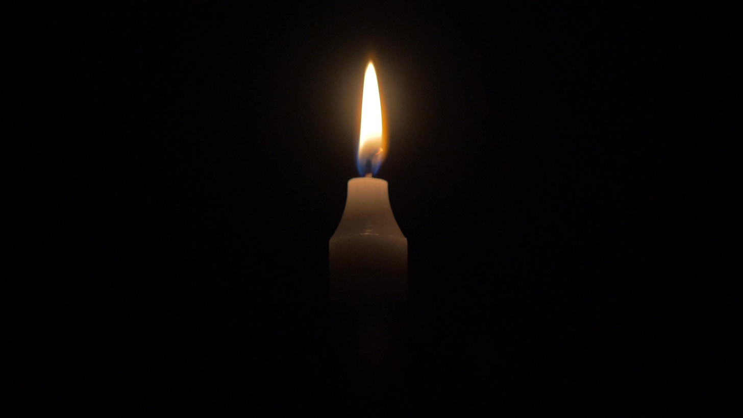 4K Candle Burning Against Black Background 1784594 Stock Video at Vecteezy