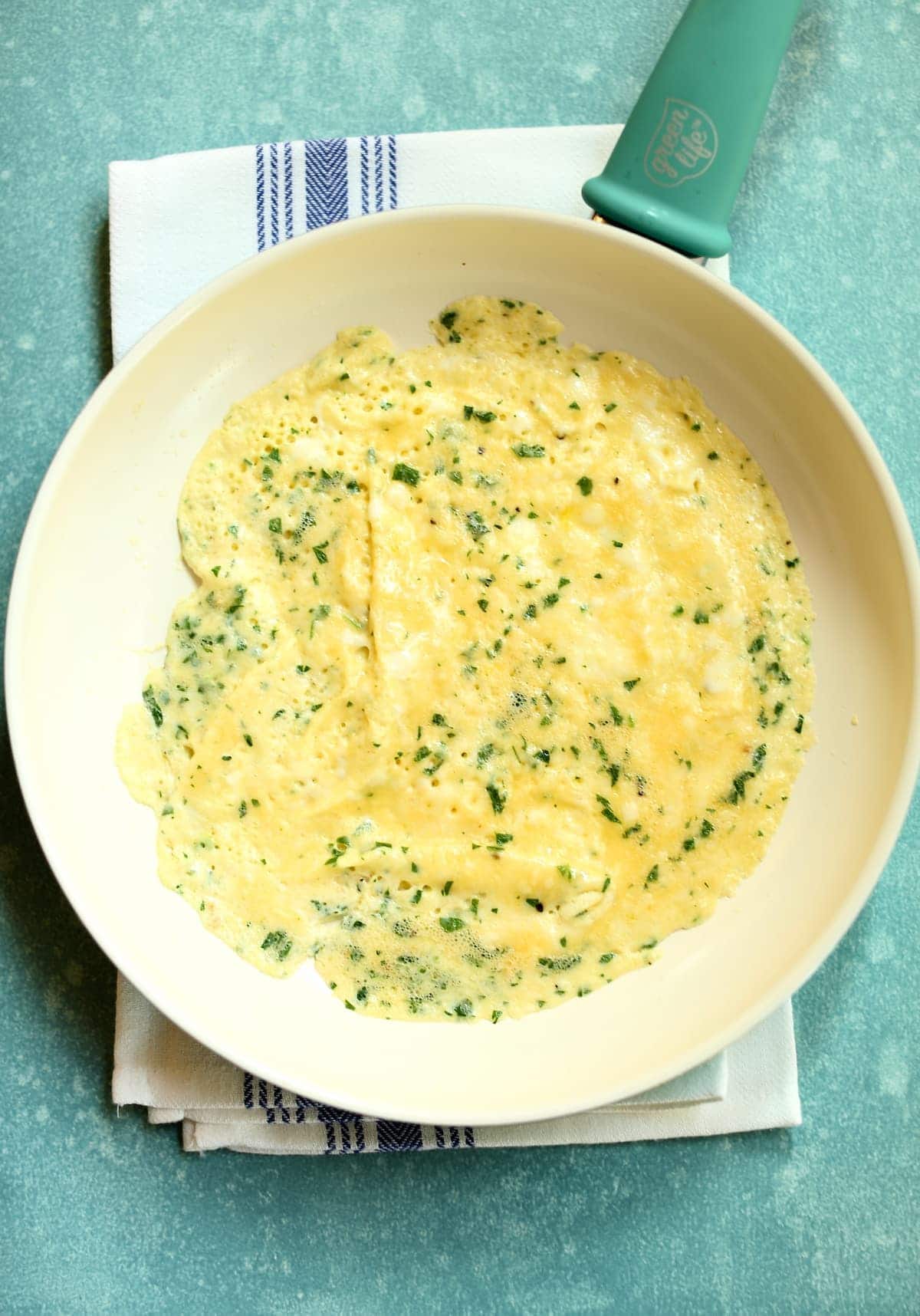 a skillet with an omelette in it.
