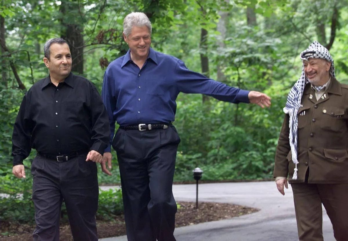 President Bill Clinton, Israeli Prime Minister Ehud Barak and Palestinian leader Yasser Arafat, at Camp David in the United States, July 2000.