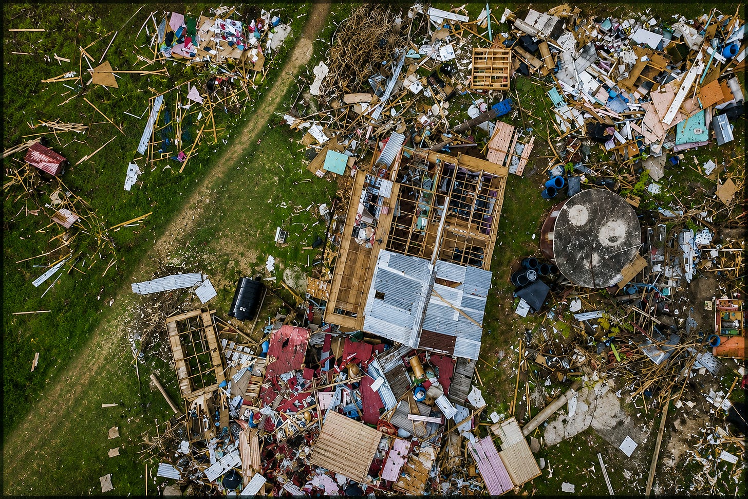 An aerial view captures the devastating aftermath of Hurricane Melissa in western Jamaica, where homes, roofing, and belongings lie scattered across the landscape. The image reflects the harsh reality facing many uninsured families after major storms, rebuilding not just property, but entire lives. An aerial view captures the devastating aftermath of Hurricane Melissa in western Jamaica, where homes, roofing, and belongings lie scattered across the landscape. The image reflects the harsh reality facing many uninsured families after major storms, rebuilding not just property, but entire lives.