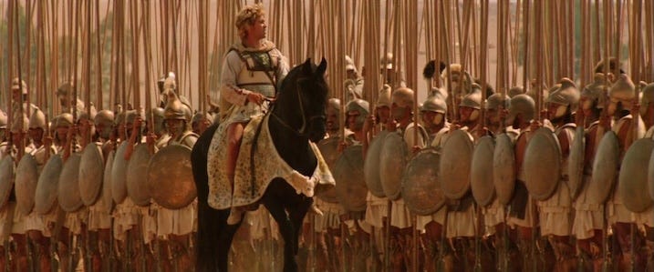 Colin Farrell leading Macedonian army – Alexander on horseback in front of a formation of soldiers with spears in Alexander Revisited: The Final Cut. Note: Still shown is promotional and not taken directly from the 4K UHD.
