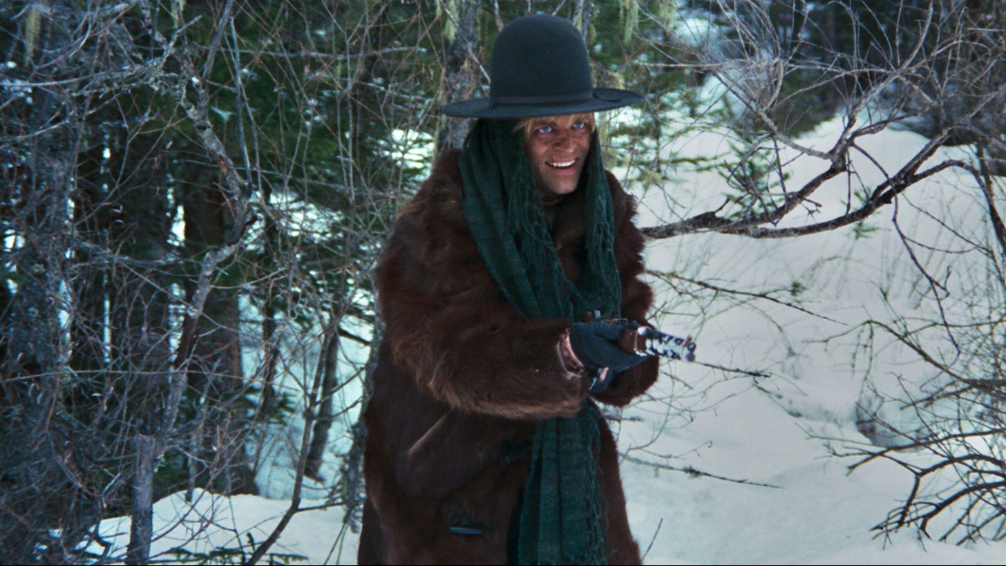 The Great Silence | Still features Klaus Kinski as Loco wielding a gun. The Great Silence | Still features Klaus Kinski as Loco wielding a gun.