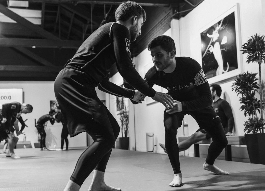 man in black long sleeve shirt and black pants doing push up man in black long sleeve shirt and black pants doing push up