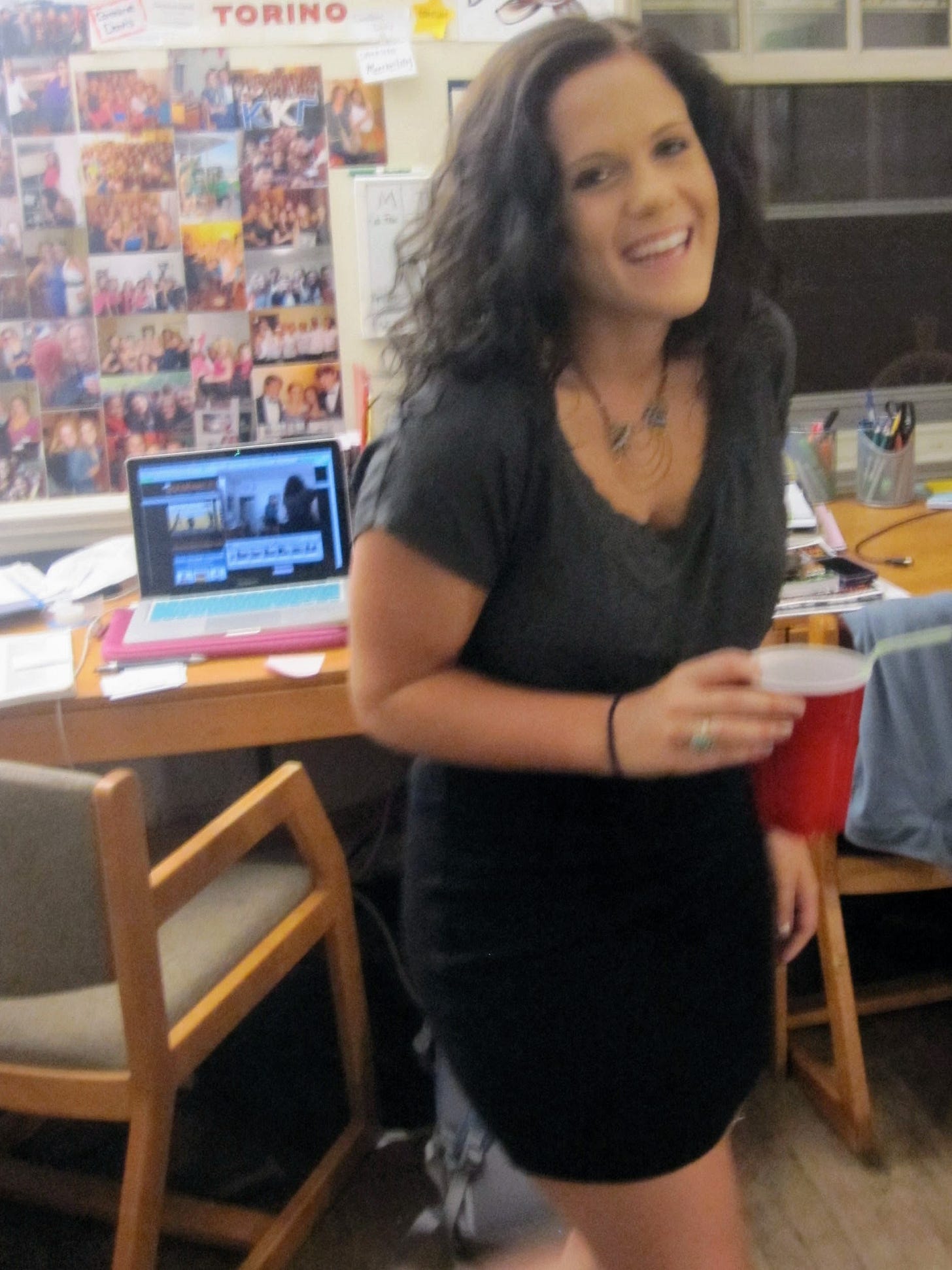 Caroline Davis as a college student at Harvard with accidentally dyed black hair, holding a red cup Caroline Davis as a college student at Harvard with accidentally dyed black hair, holding a red cup