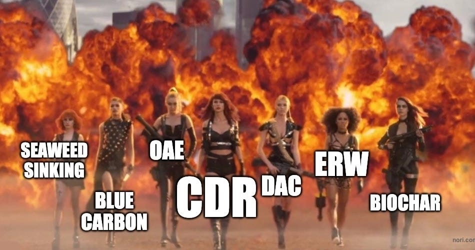 The Bad Blood music video squad walking away from an explosion, each woman labelled with a pathway: seaweed sinking, blue carbon, OAE, CDR, DAC, ERW, biochar.