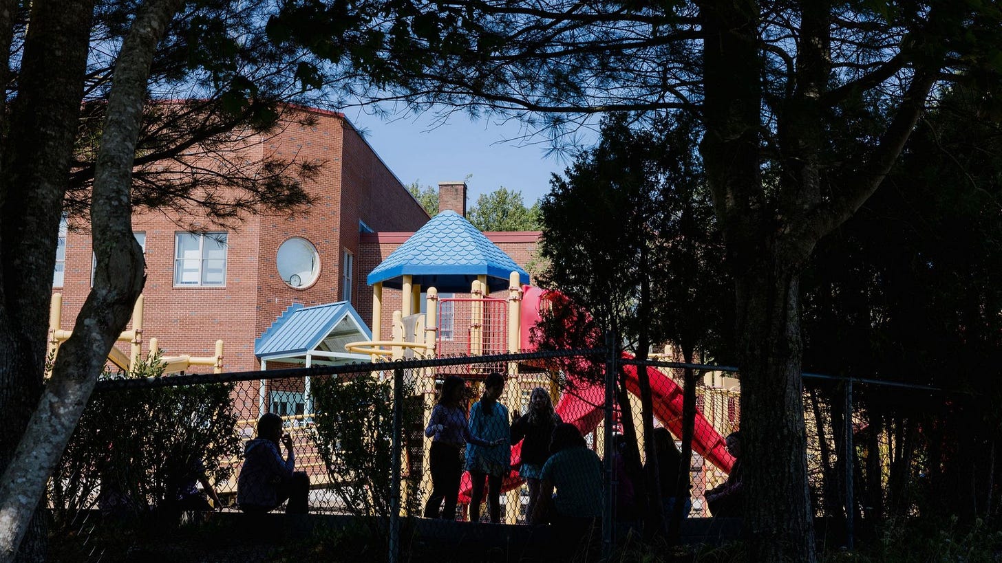 Children playing on a playground. Children playing on a playground.