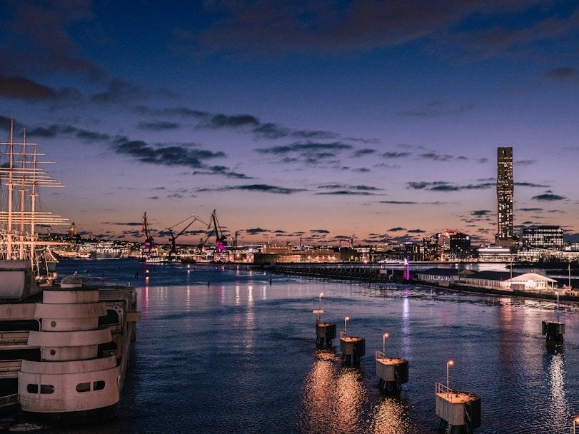 Cityscape with harbor lights at dusk
