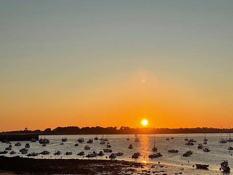A collection of nine photos taken in Brittany, featuring a group of four friends on a hike and eight scenic coastal landscapes, including lighthouses, cliffs, boats, and traditional villages under varied summer light