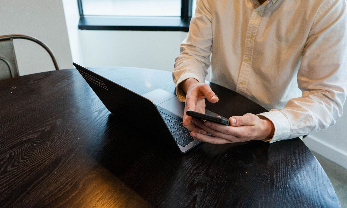 A person using a phone and a laptop (Credit: Matt_Moloney / Freerange) A person using a phone and a laptop (Credit: Matt_Moloney / Freerange)