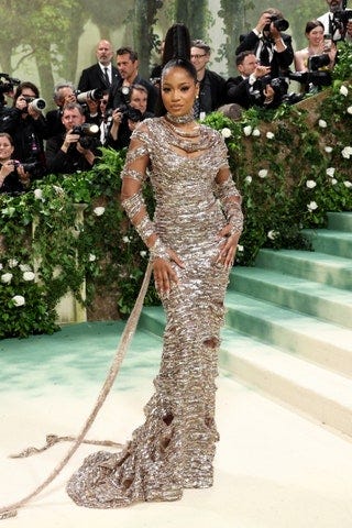 Image may contain Keke Palmer Person Adult Wedding Camera Electronics Accessories Glasses Formal Wear and Tie